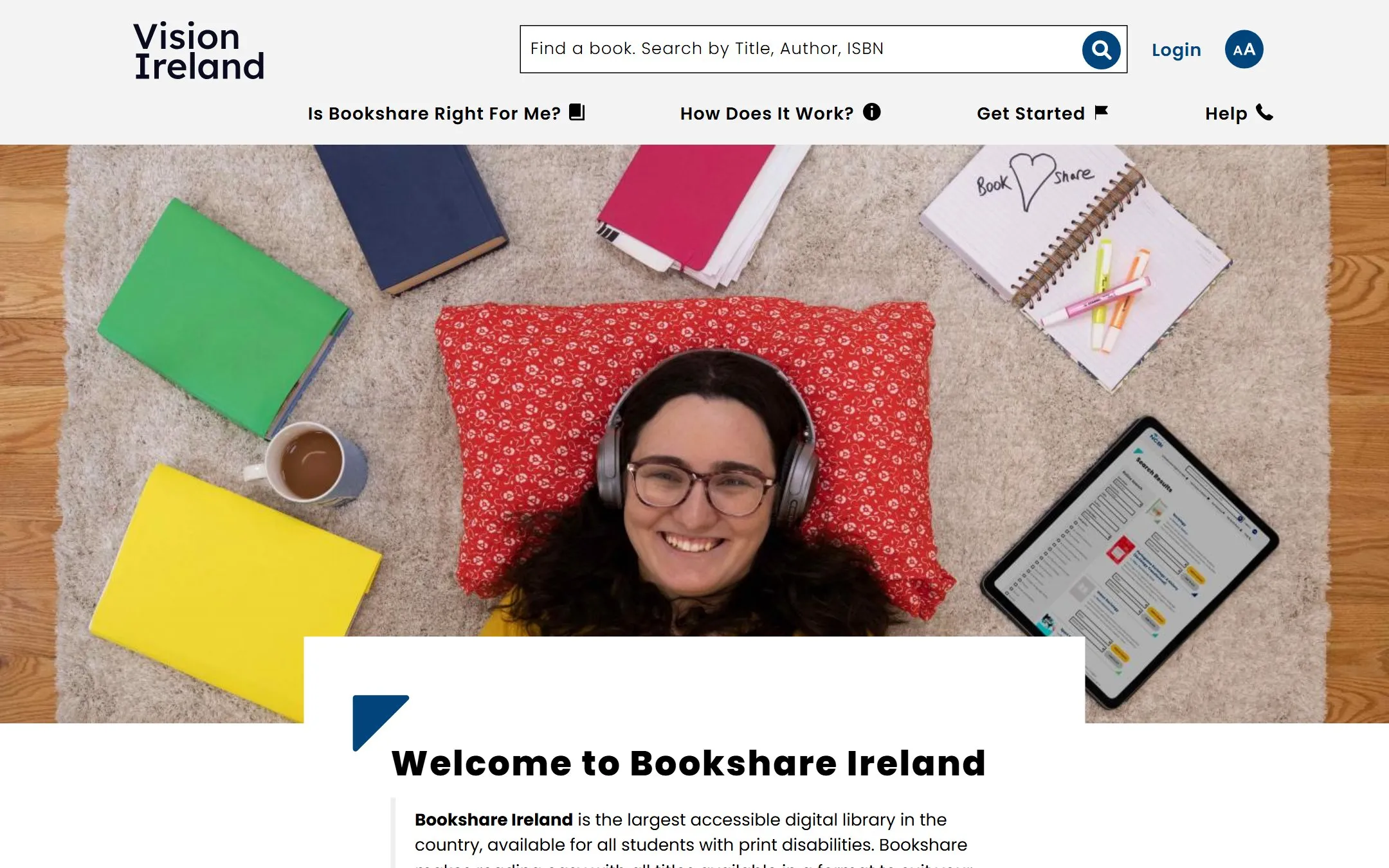 Bookshare Ireland homepage with a book search bar, text-size control and a photo of a student listening with headphones beside books and a tablet.